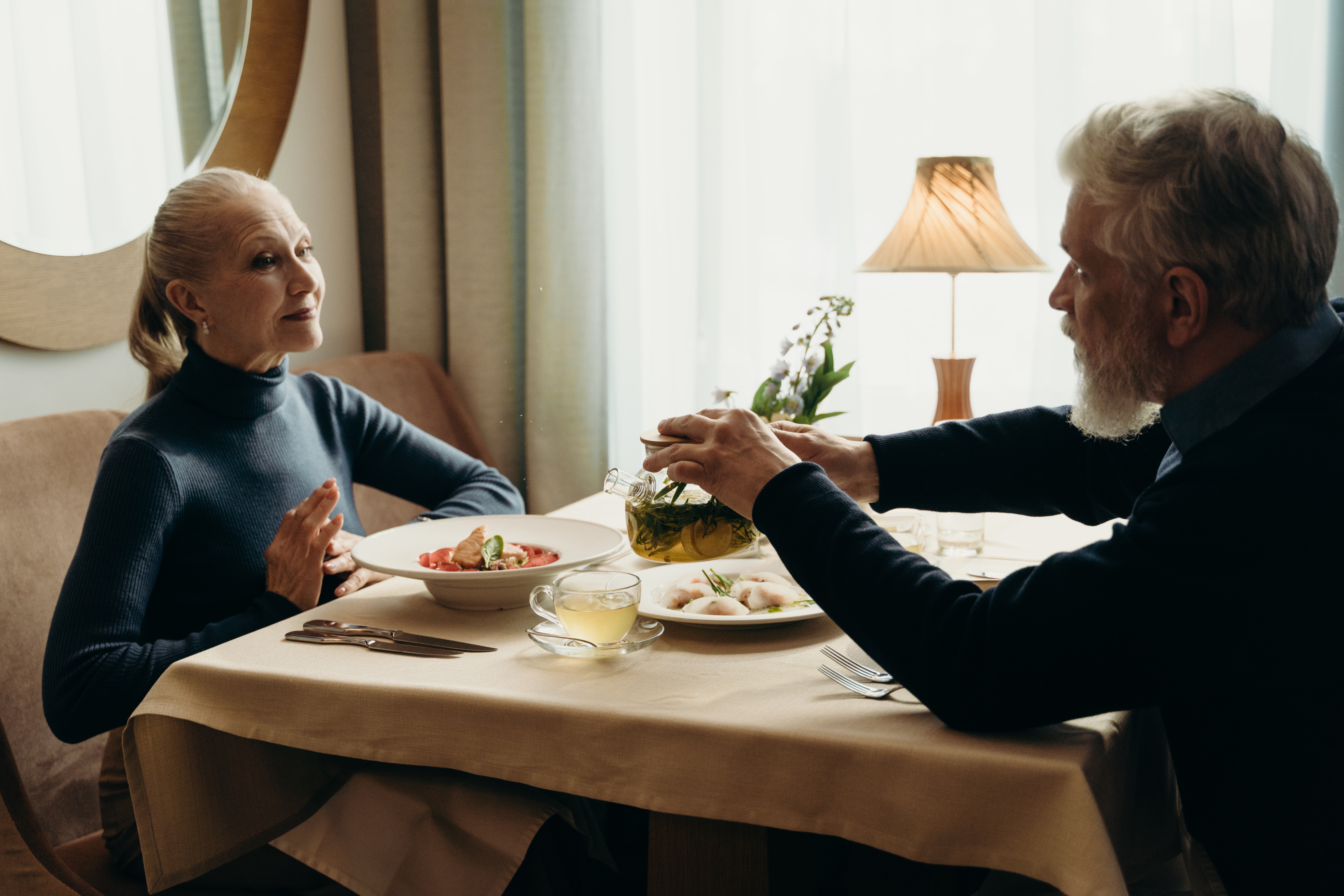 Couple on vacation enjoying a meal at a local restaurant