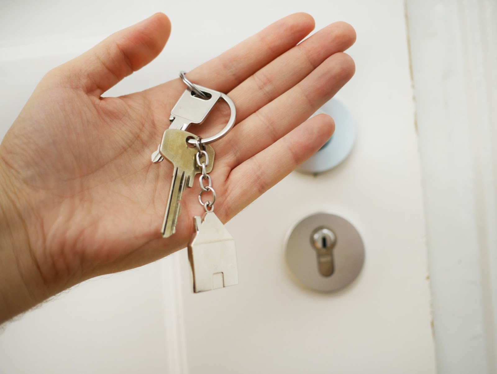 graphic of person holding up new keys